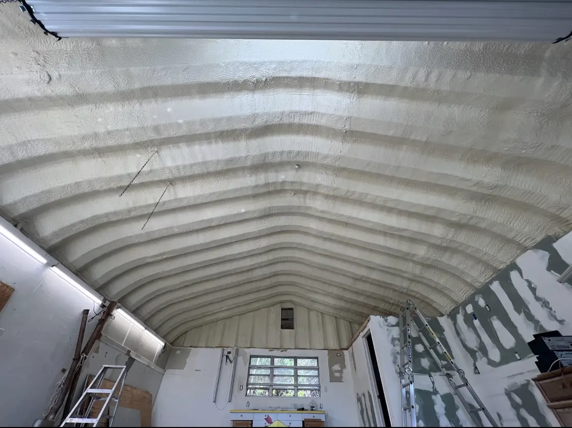 Spray polyurethane foam applied to the underside of a metal roof deck in Flagler Beach